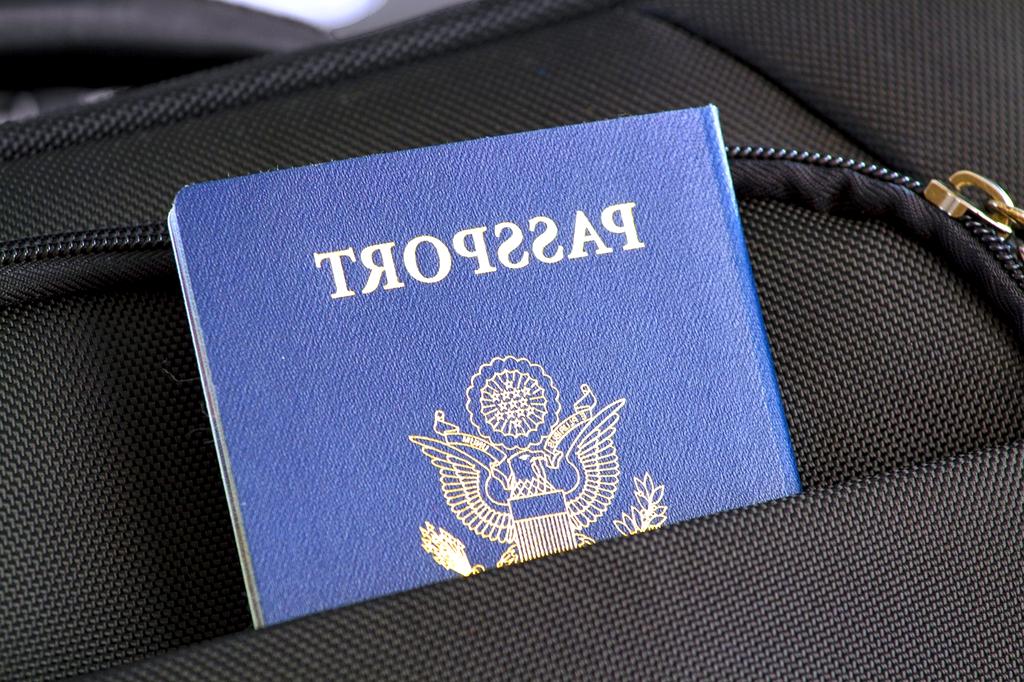 Passport and visa documents on a table